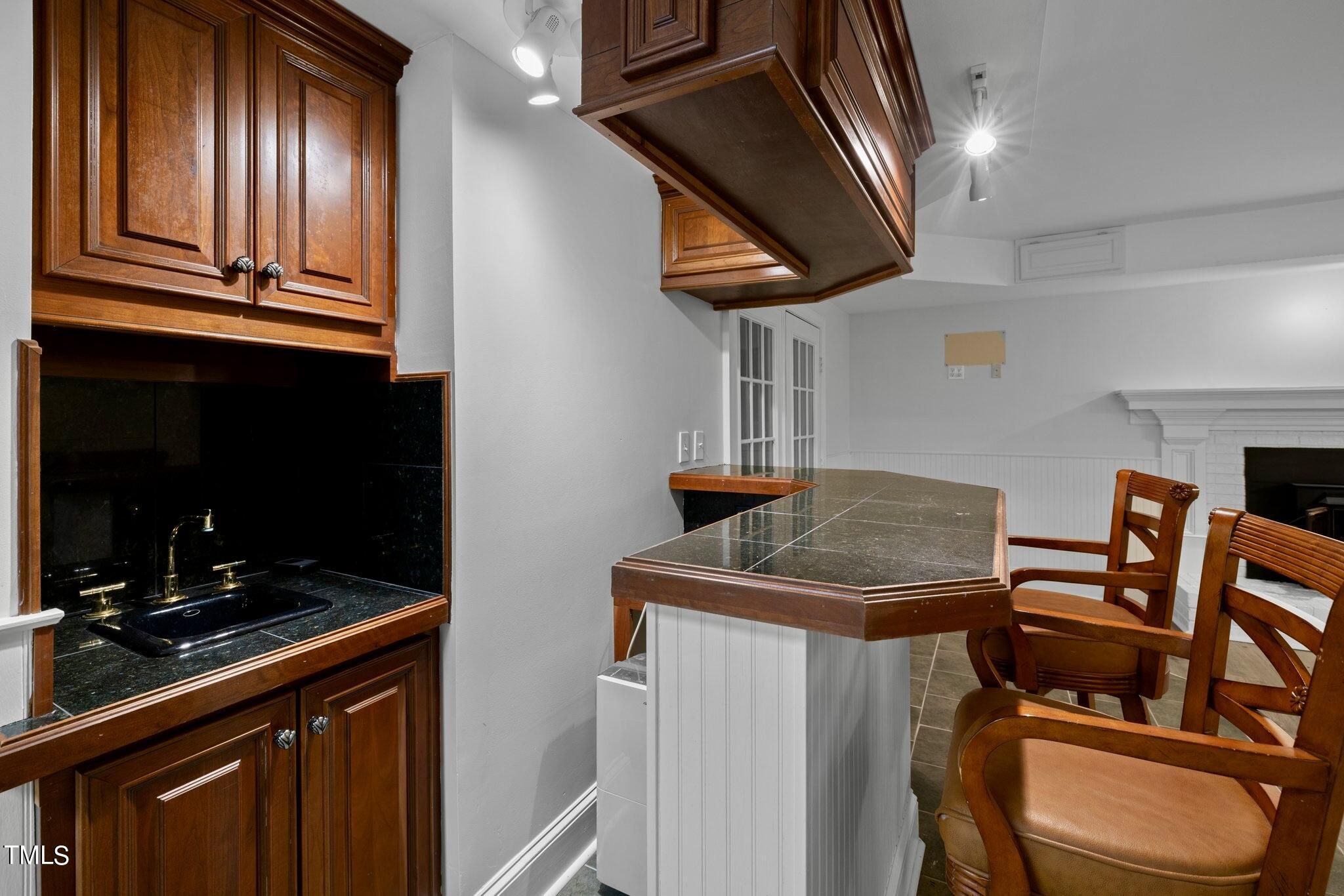 4099 Blackard Pond Road Raleigh, NC 27604 - Photo 76 of 94 a kitchen with stainless steel appliances granite countertop a sink a stove and a microwave oven