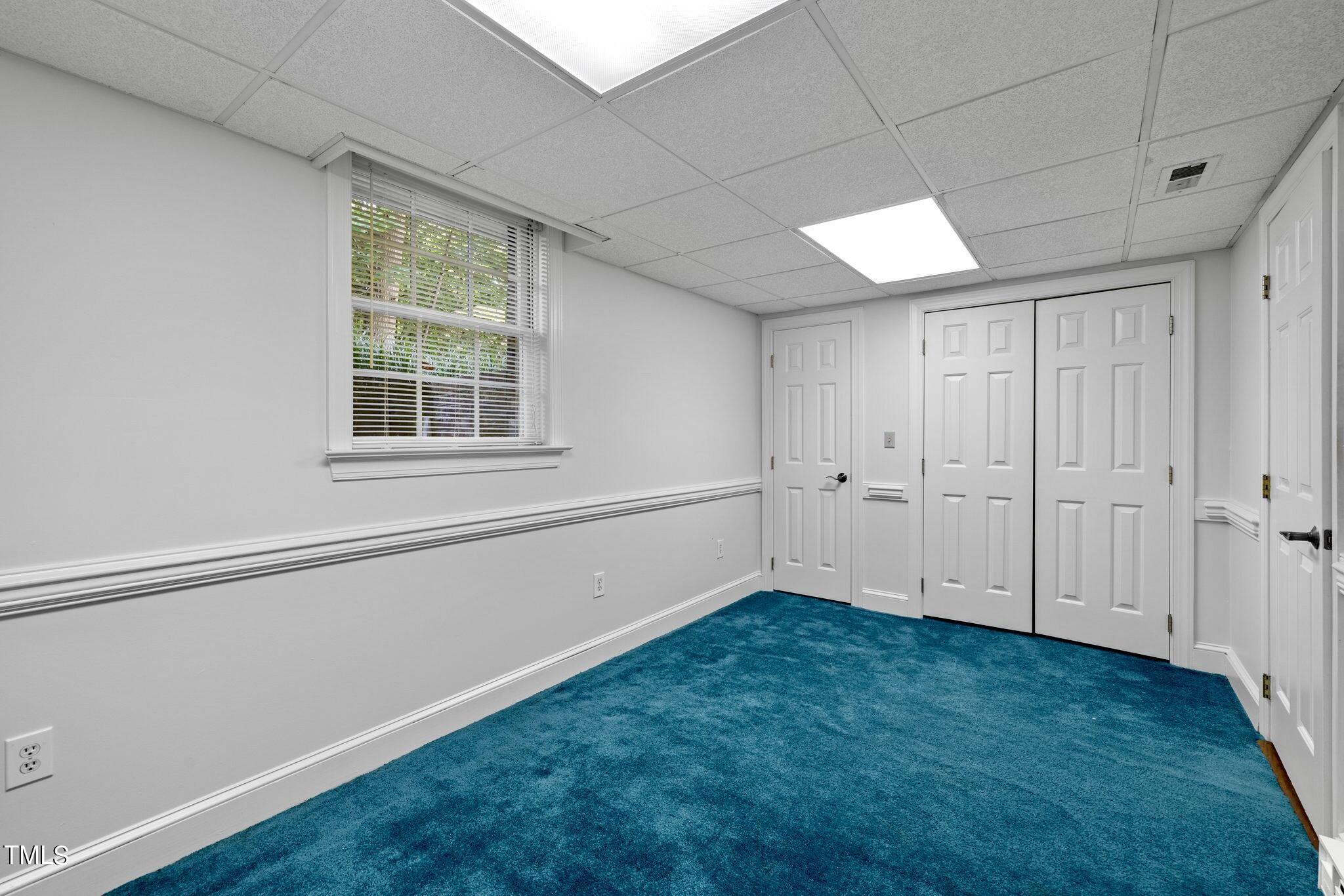 4099 Blackard Pond Road Raleigh, NC 27604 - Photo 80 of 94 an empty room with wooden floor and windows