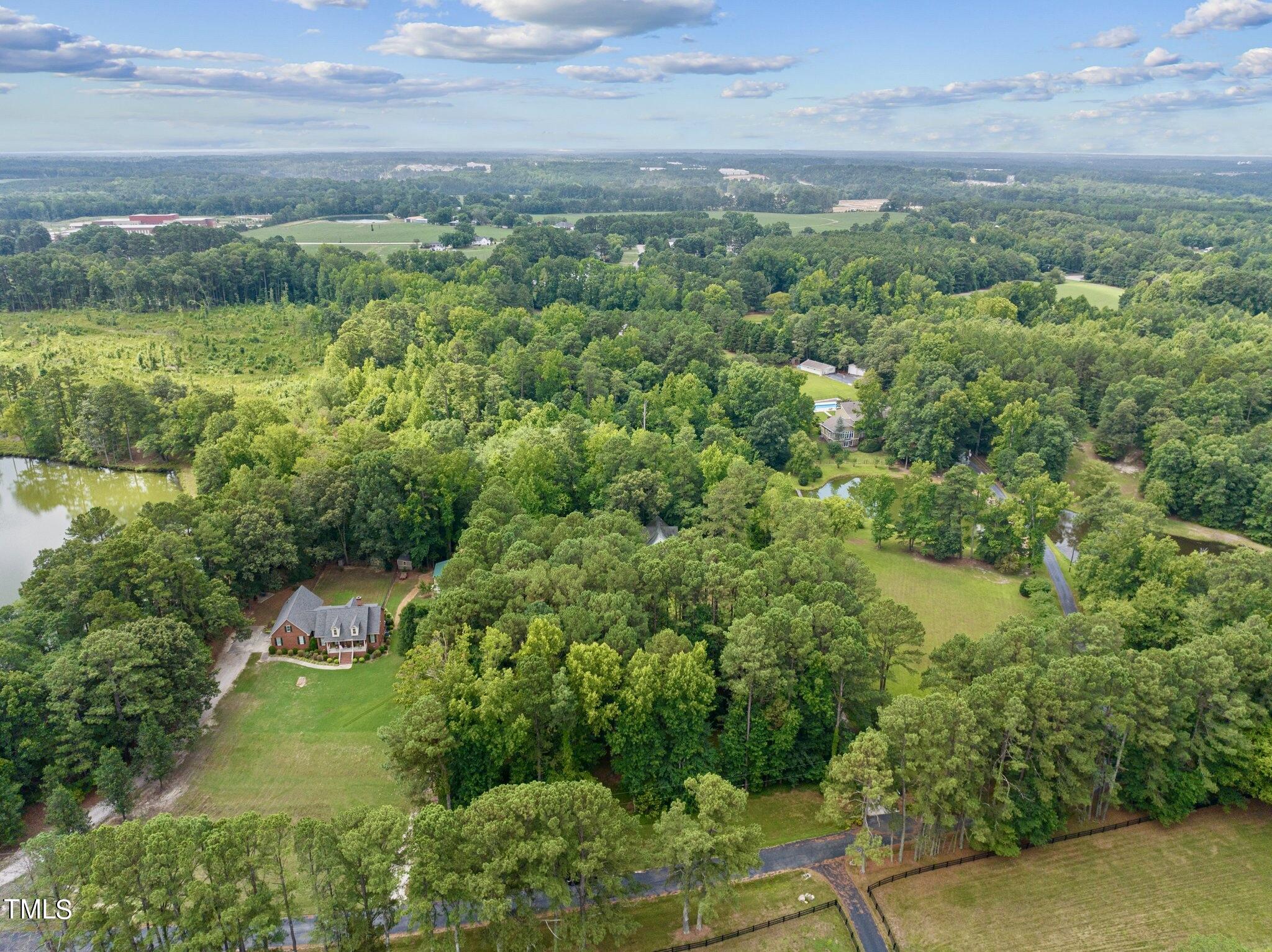 4099 Blackard Pond Road Raleigh, NC 27604 - Photo 90 of 94 a view of a lake with a yard