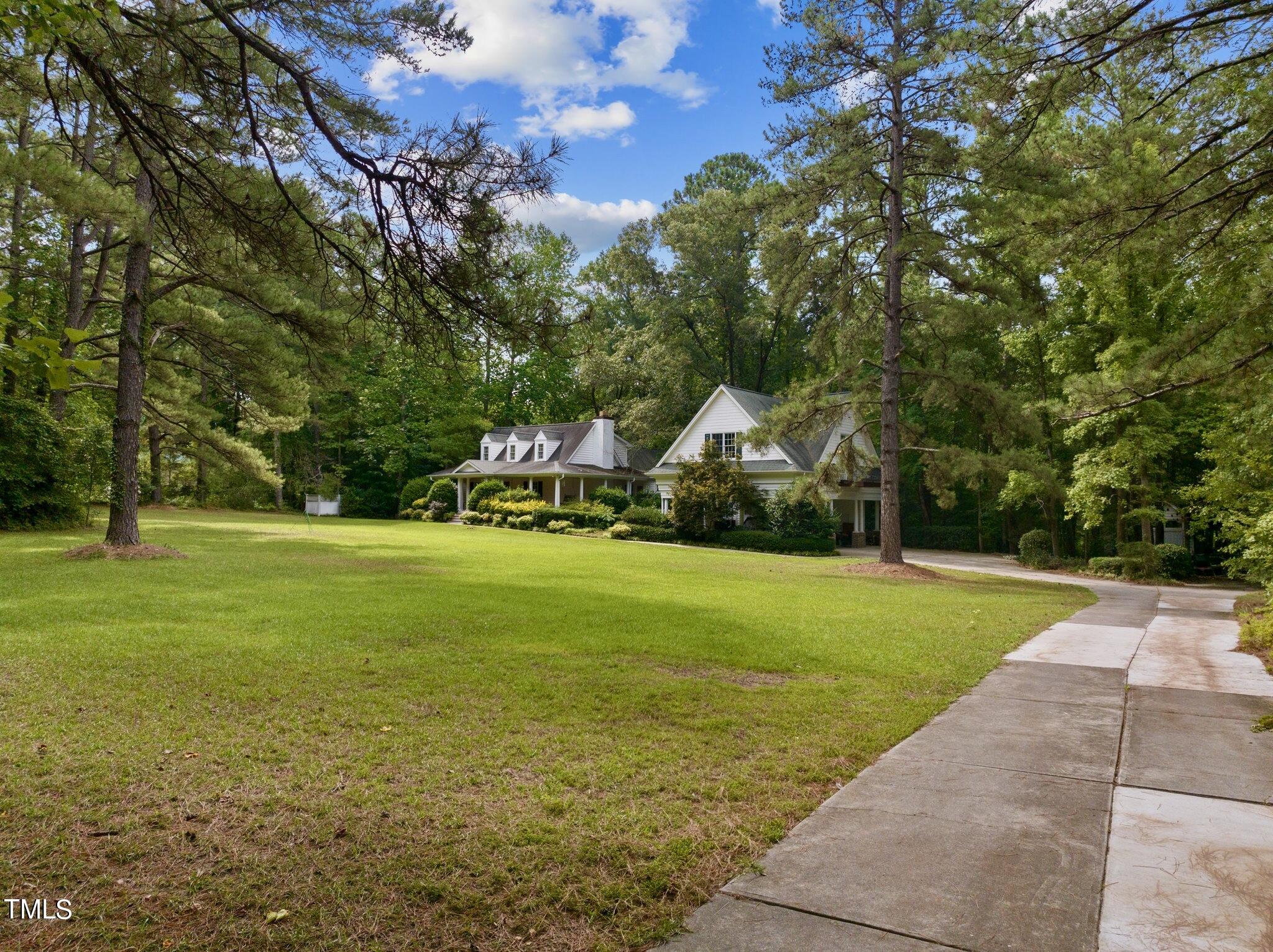 4099 Blackard Pond Road Raleigh, NC 27604 - Photo 10 of 94 a view of yard with swimming pool and green space