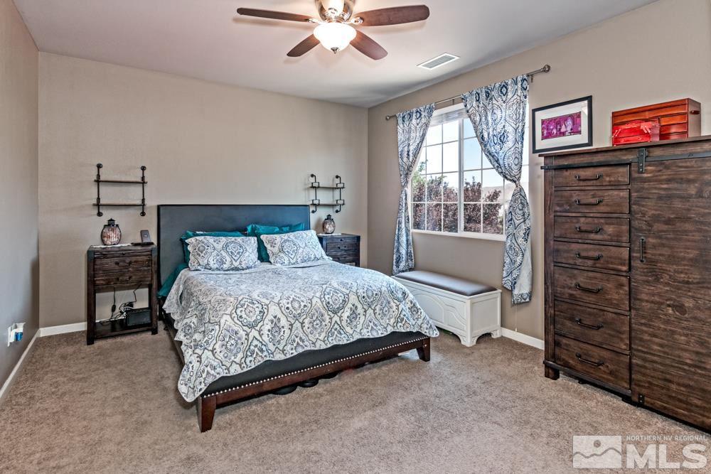 1893 Resistol Drive Reno, NV 89521 - Photo 13 of 26 a bedroom with a bed and a window