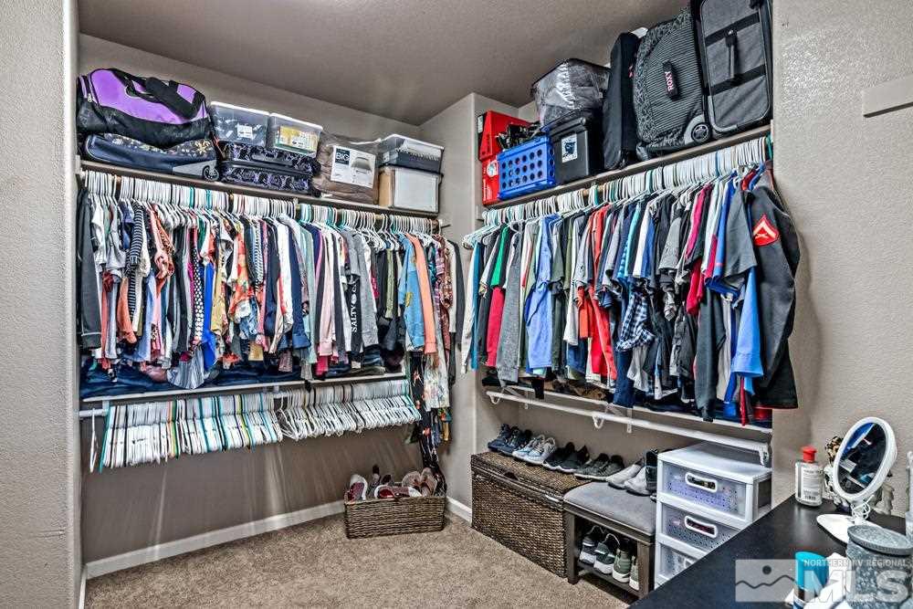 1893 Resistol Drive Reno, NV 89521 - Photo 15 of 26 a view of walk in closet with clothes and shoes