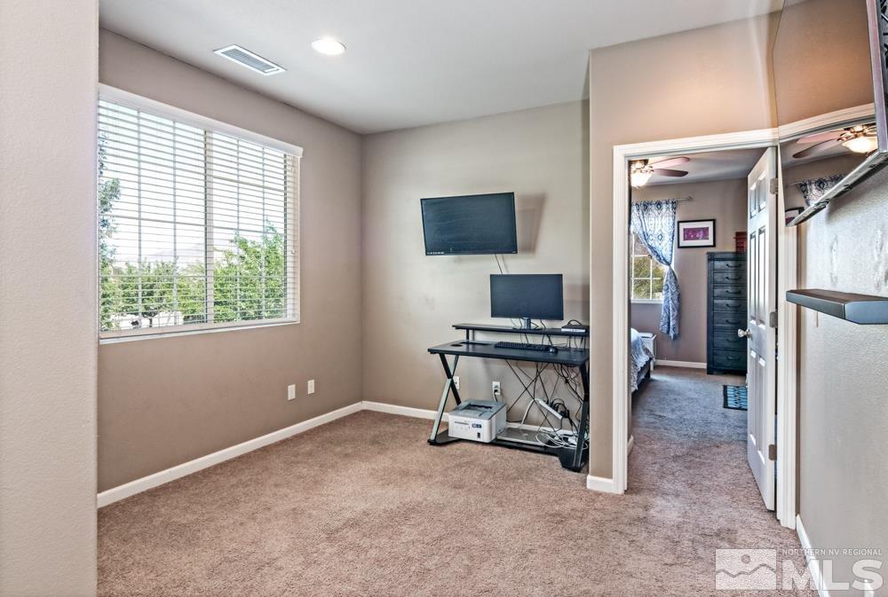 1893 Resistol Drive Reno, NV 89521 - Photo 16 of 26 a view of a workspace with furniture and a window