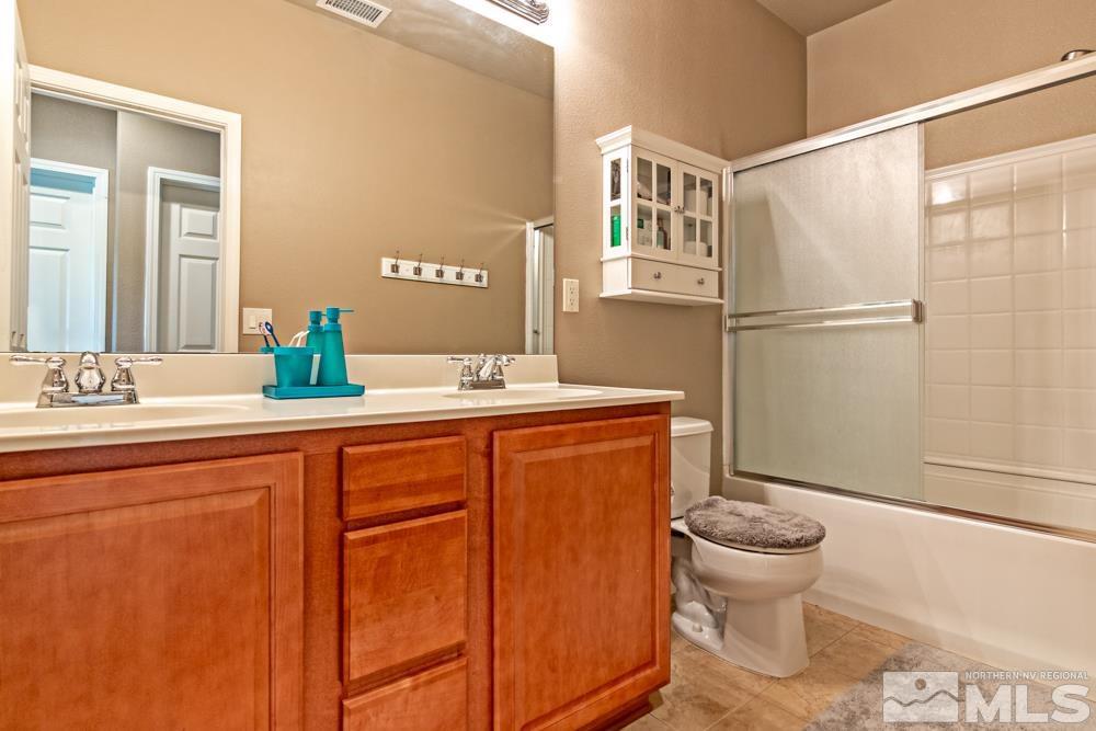 1893 Resistol Drive Reno, NV 89521 - Photo 19 of 26 a bathroom with a sink toilet and shower