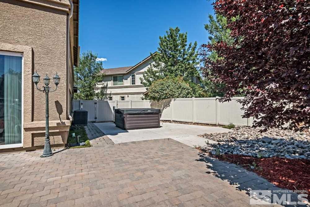 1893 Resistol Drive Reno, NV 89521 - Photo 24 of 26 a house with a bench in front of it