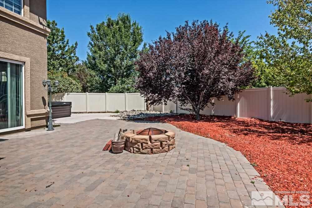1893 Resistol Drive Reno, NV 89521 - Photo 25 of 26 a view of backyard with wooden fence and large trees