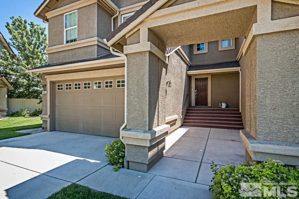 1893 Resistol Drive Reno, NV 89521 - Photo 3 of 26 a front view of a house with a garden