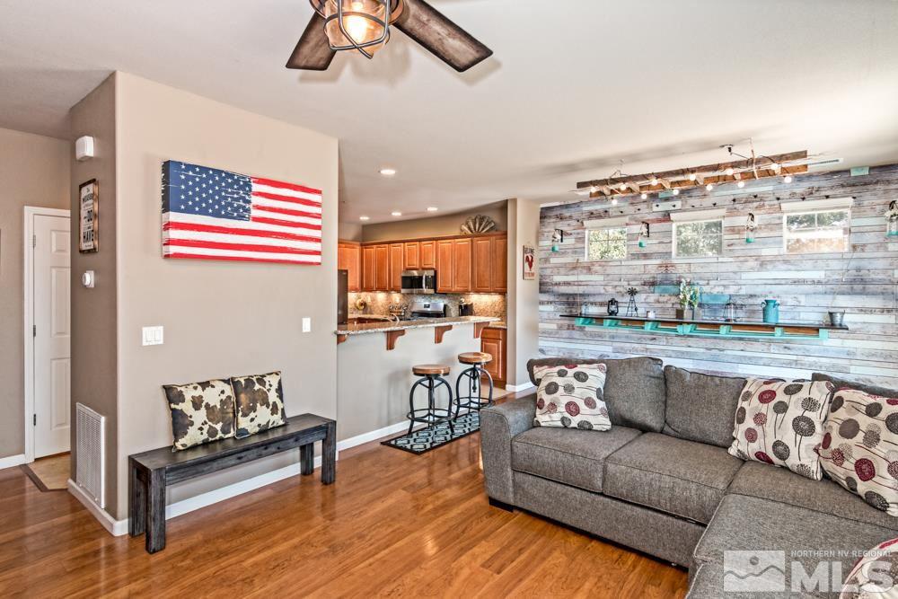 1893 Resistol Drive Reno, NV 89521 - Photo 7 of 26 a living room with furniture and a floor to ceiling window