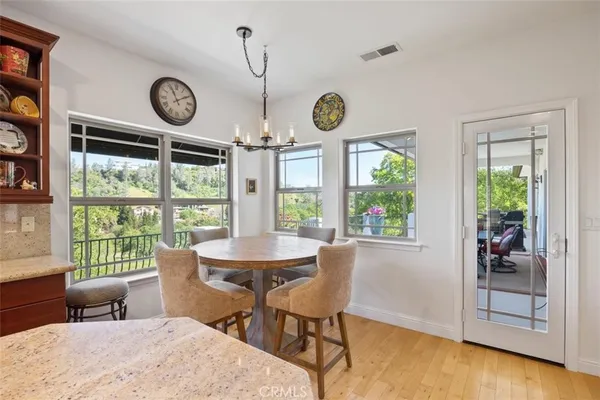 a living room with fireplace furniture and a large window