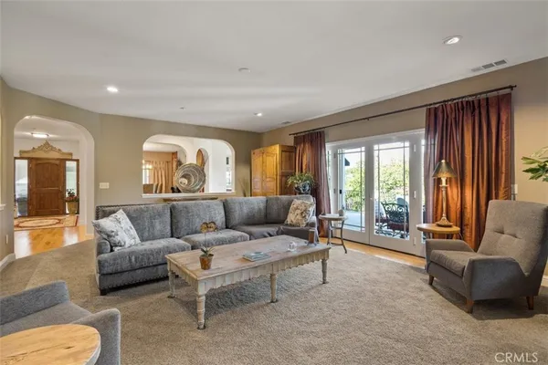 a living room with furniture and windows