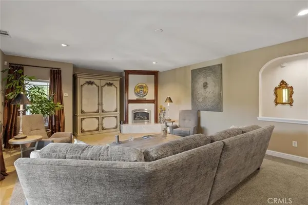 a bedroom with a bed couch and window