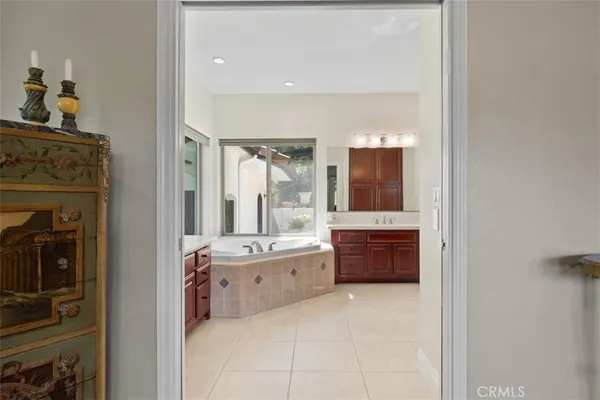 a large bathroom with a large tub shower and sink