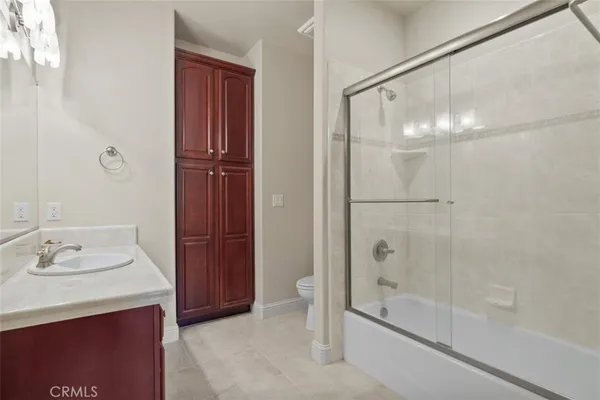 a spacious bathroom with a sink double vanity and a mirror