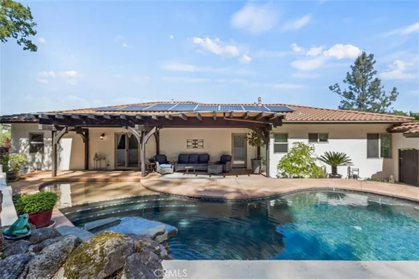 a view of a swimming pool with a patio
