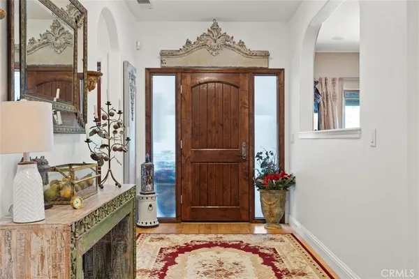 a view of livingroom and dining room with wooden floor