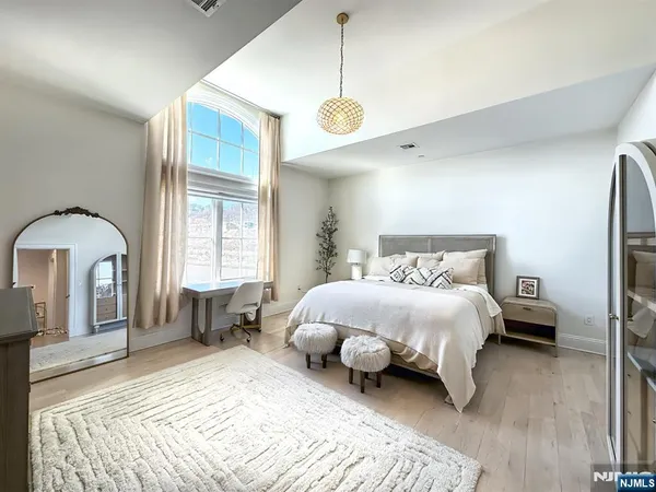 a white bath tub sitting next to a bathroom