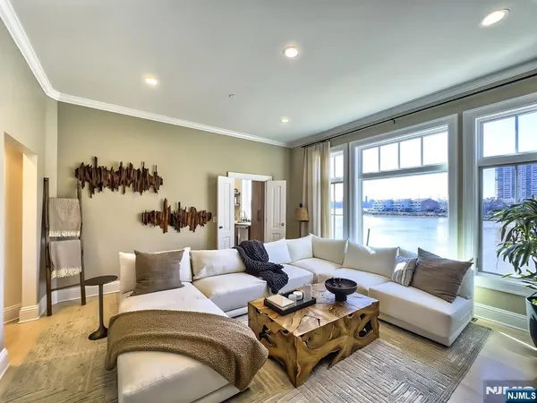 a view of a balcony with wooden floor and iron fence