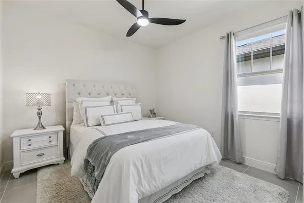 a bedroom with a bed and a tv