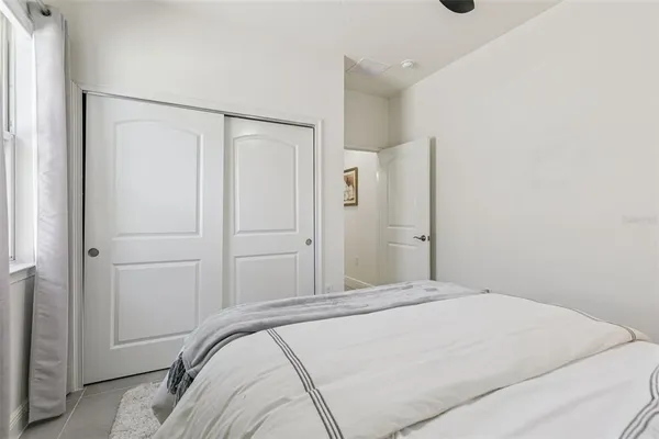 a bedroom with a bed and a shower