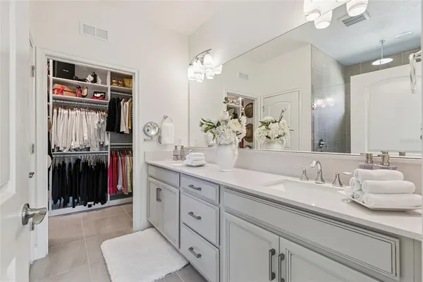 a spacious bathroom with a double vanity sink double vanity and a mirror