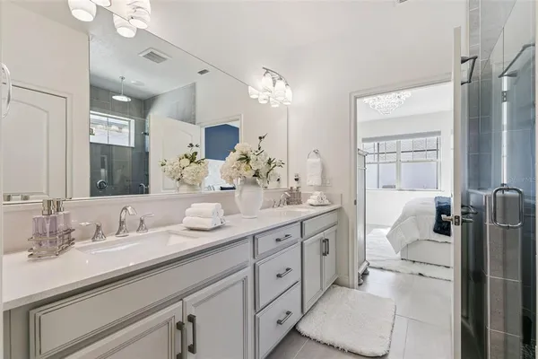 a spacious bathroom with a double vanity sink mirror and toilet