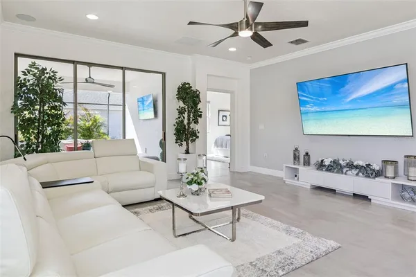 a living room with furniture and a large window