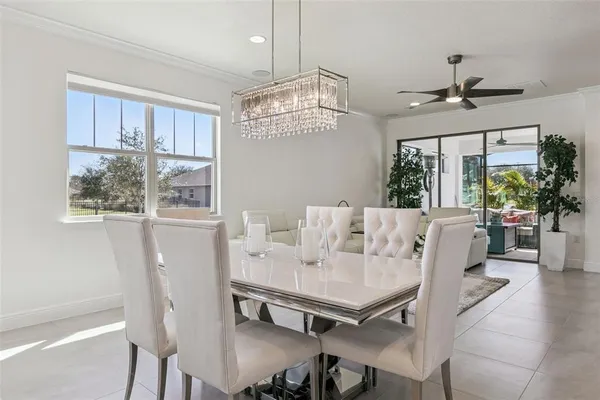 a view of a dining room with furniture window and outside view