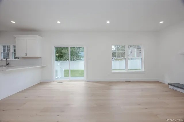 a view of a kitchen with a sink cabinets and a window