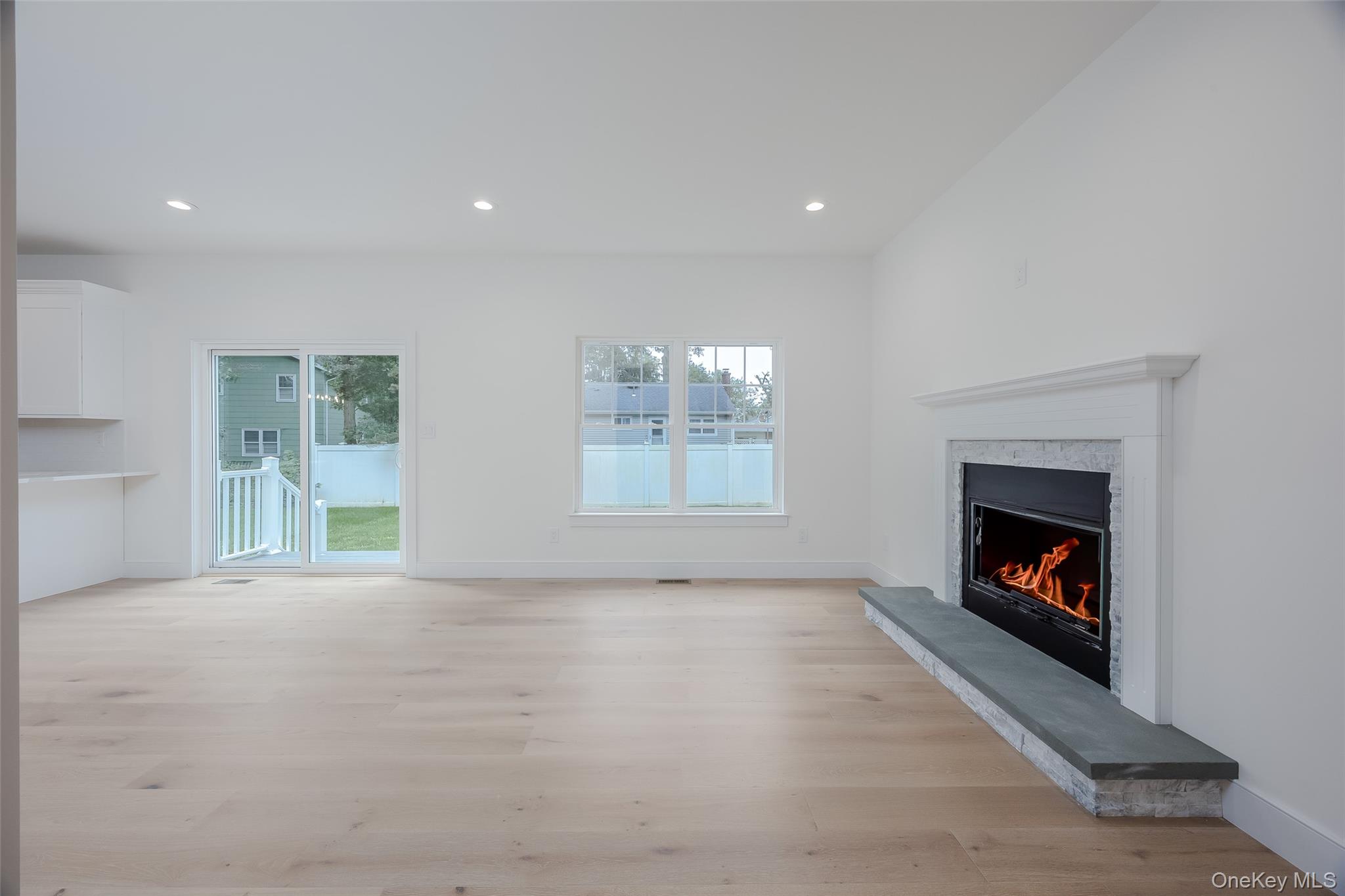 40 Zenith Road Rocky Point, NY 11778 - Photo 18 of 38 a view of an empty room with a fireplace and a window