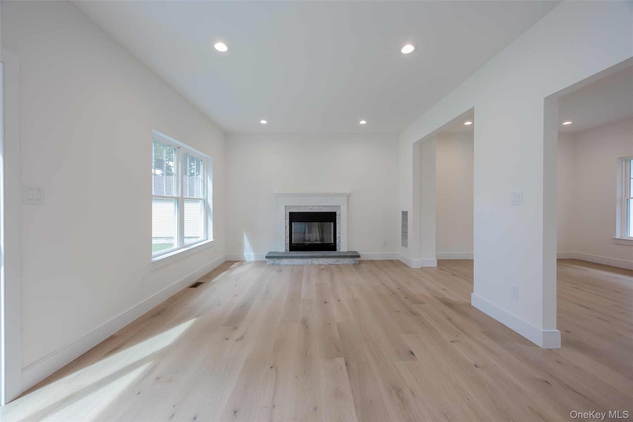 40 Zenith Road Rocky Point, NY 11778 - Photo 20 of 38 an empty room with wooden floor and windows