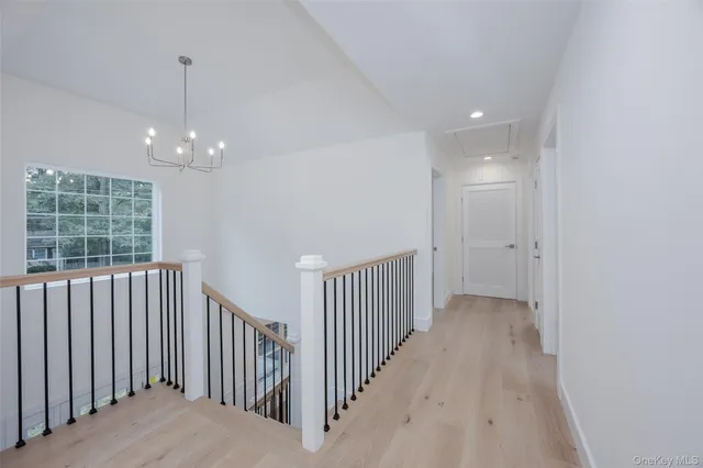 a view of a hallway with windows