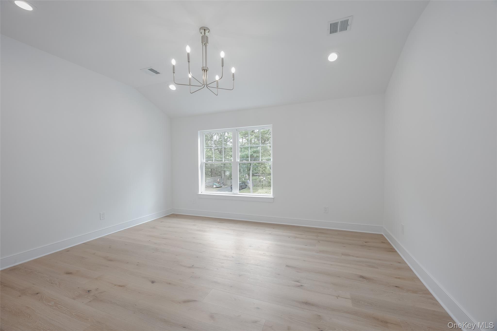 40 Zenith Road Rocky Point, NY 11778 - Photo 27 of 38 wooden floor in an empty room with a window