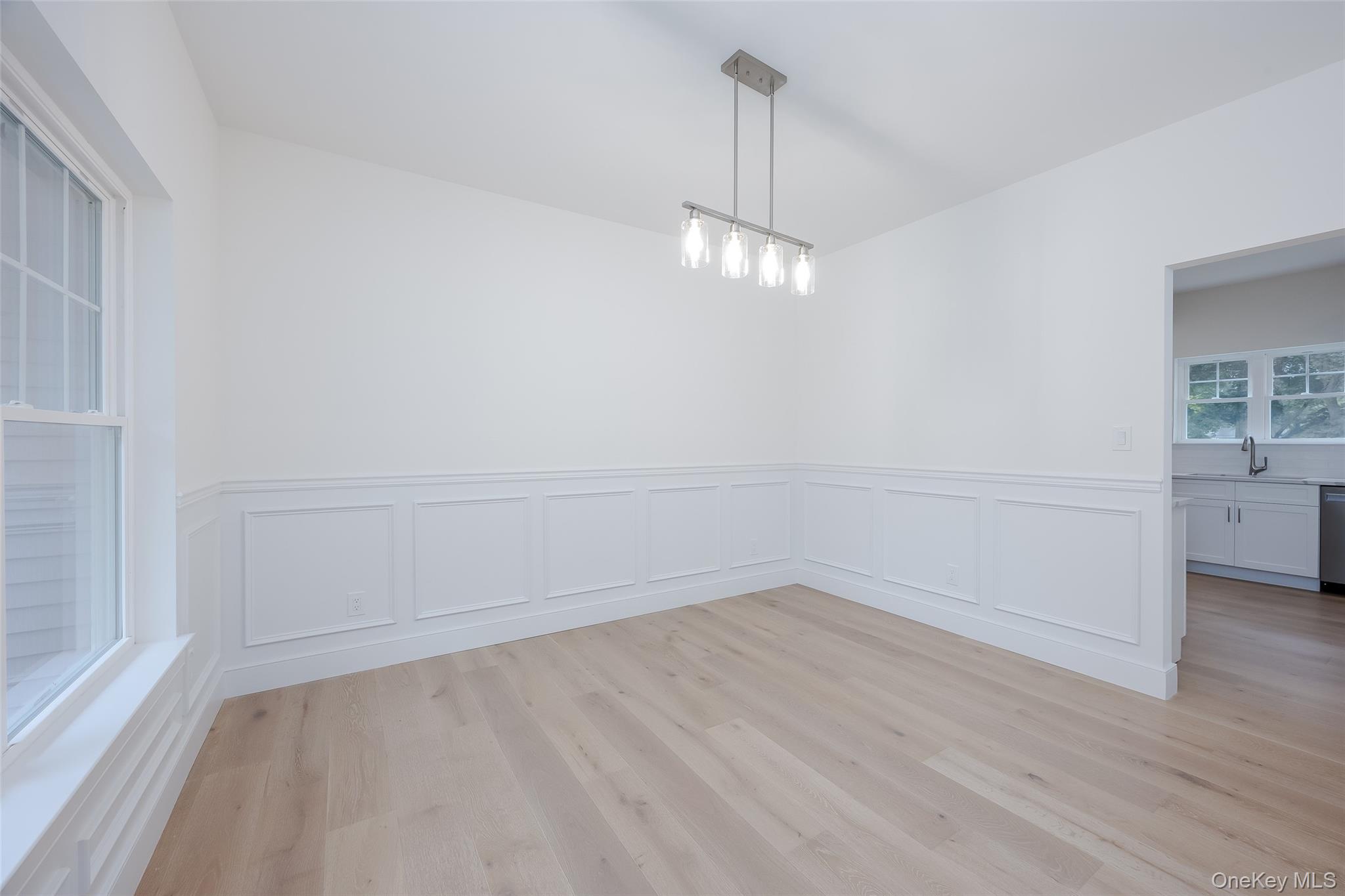 40 Zenith Road Rocky Point, NY 11778 - Photo 8 of 38 a view of empty room with wooden floor