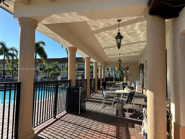 a view of a chairs and table in a balcony