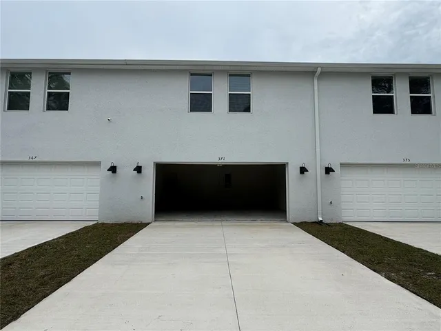 a view of a hallway with stairs