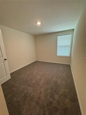 an empty room with a bathroom