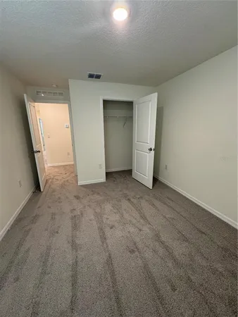 a bathroom with a sink a toilet a mirror and shower