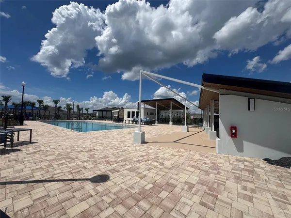 a view of a patio with swimming pool