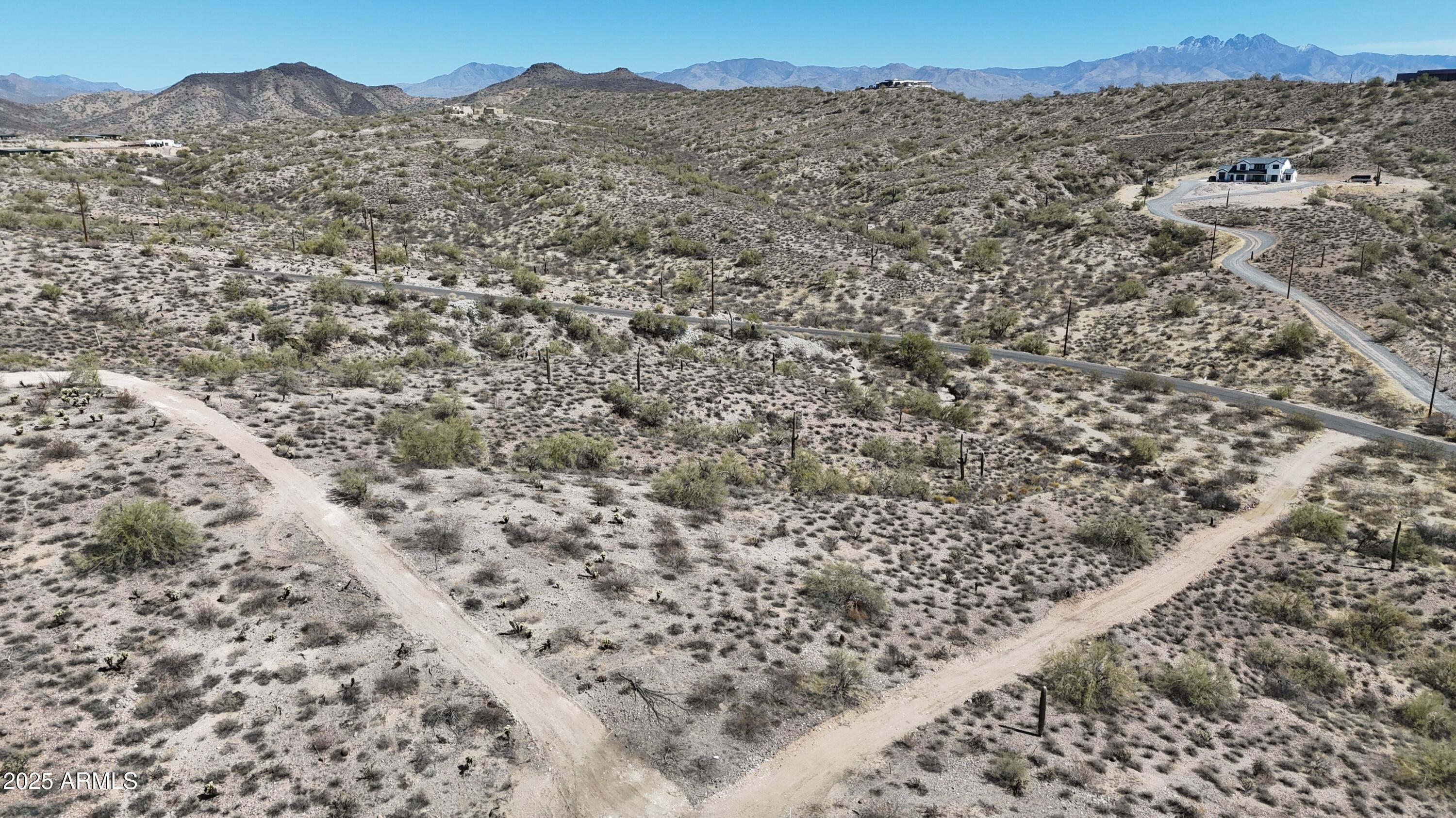 Lot 19 East K E Sandy Bluff Road, Unit 19K Fort McDowell, AZ 85264 - Photo 13 of 26 a view of a dry yard with mountains in the background