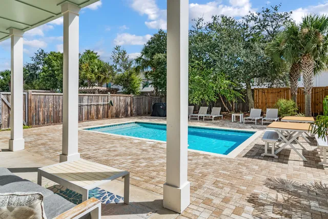 a view of a backyard with sitting area