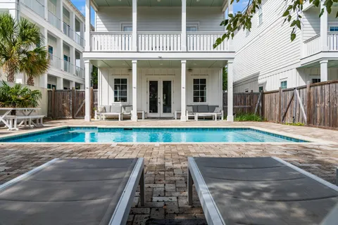a living room with furniture kitchen view and a table