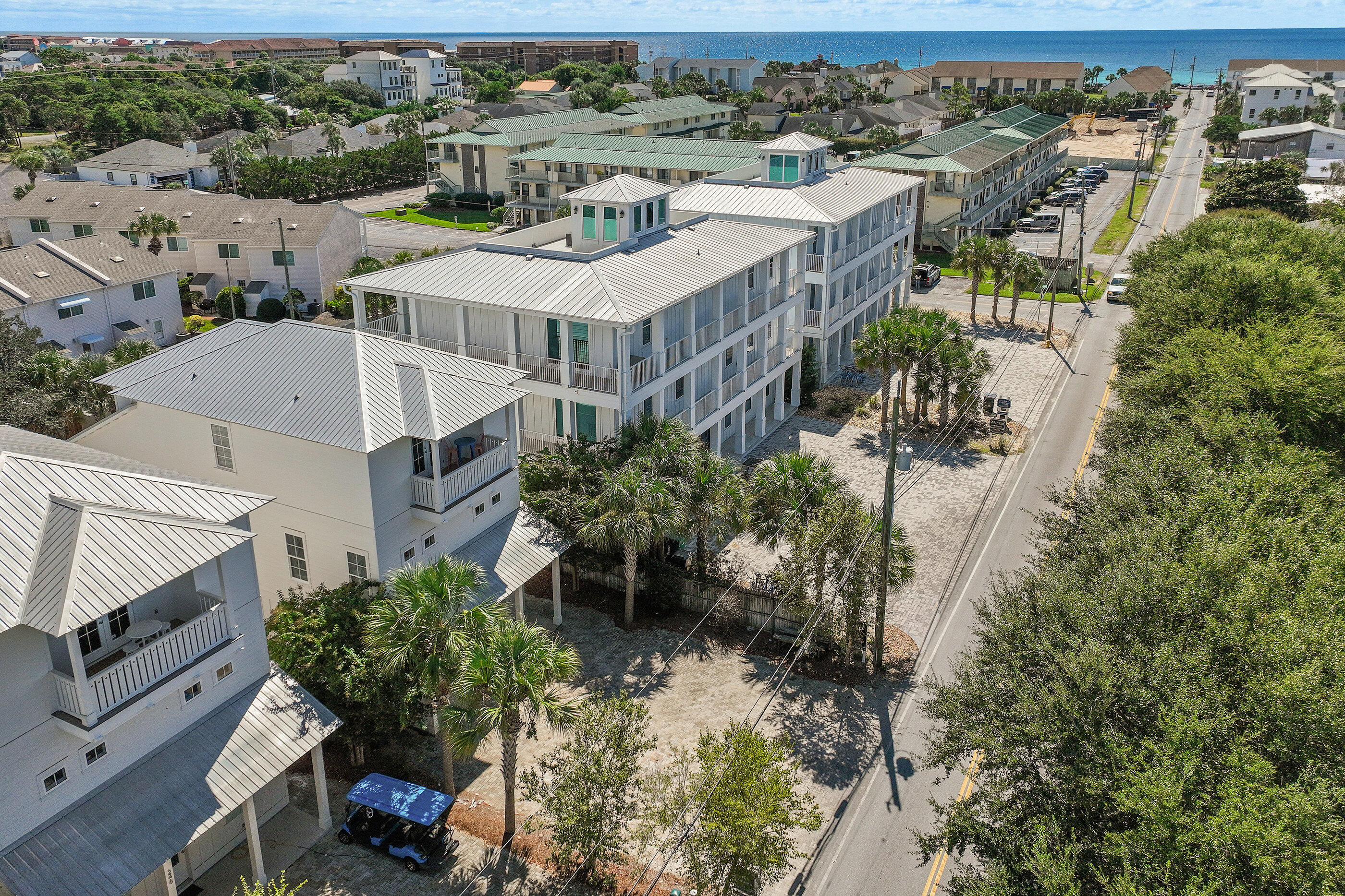 240 Driftwood Road Miramar Beach, FL 32550 - Photo 2 of 65 an aerial view of a house with a yard patio and a fountain