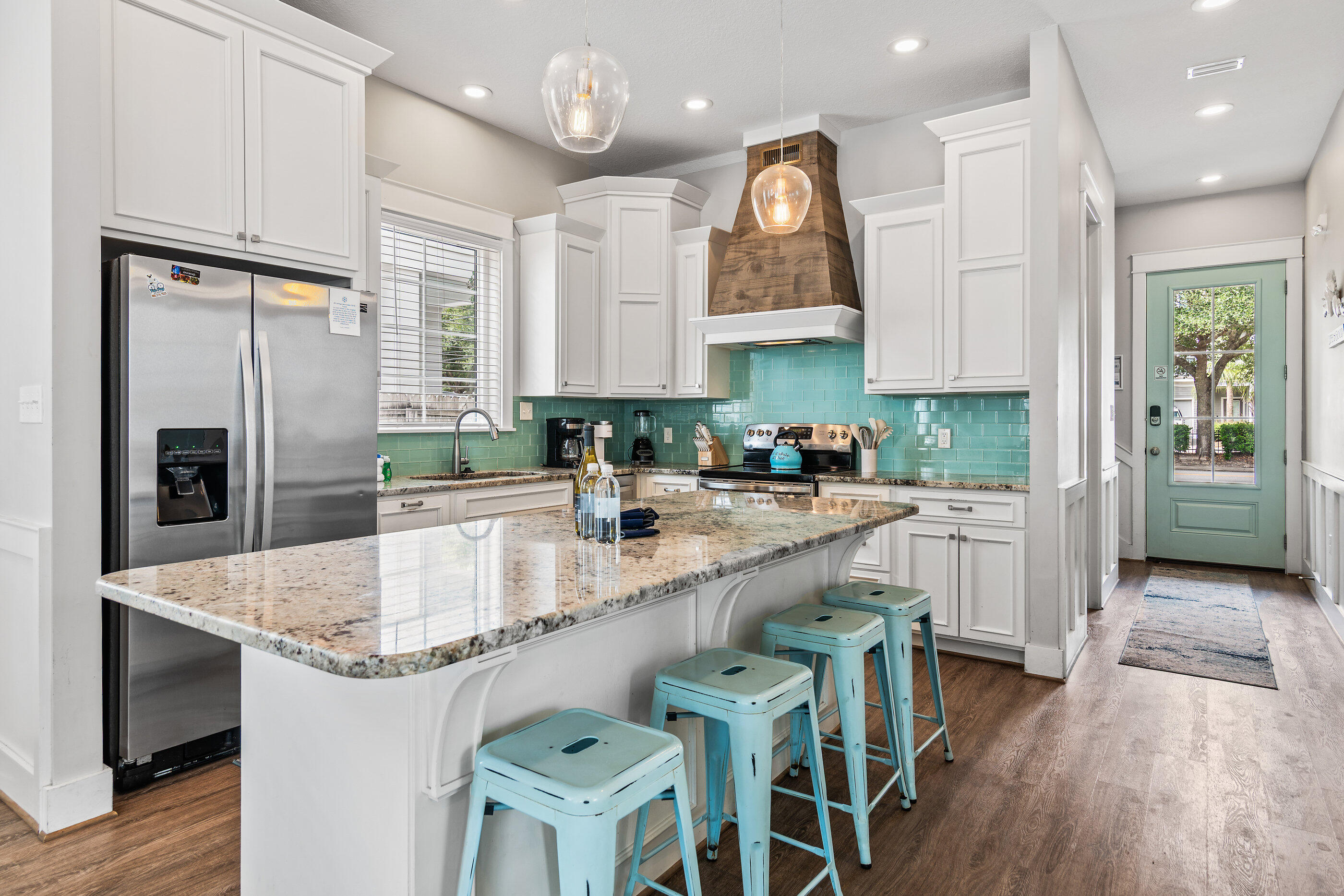 240 Driftwood Road Miramar Beach, FL 32550 - Photo 31 of 65 a kitchen with stainless steel appliances granite countertop a sink refrigerator and cabinets
