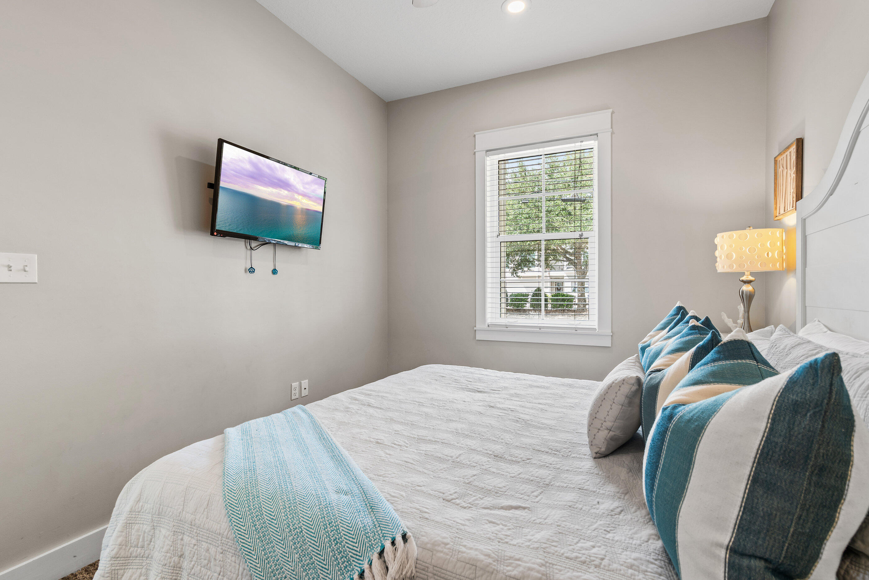 240 Driftwood Road Miramar Beach, FL 32550 - Photo 36 of 65 a bedroom with a bed and a flat screen tv