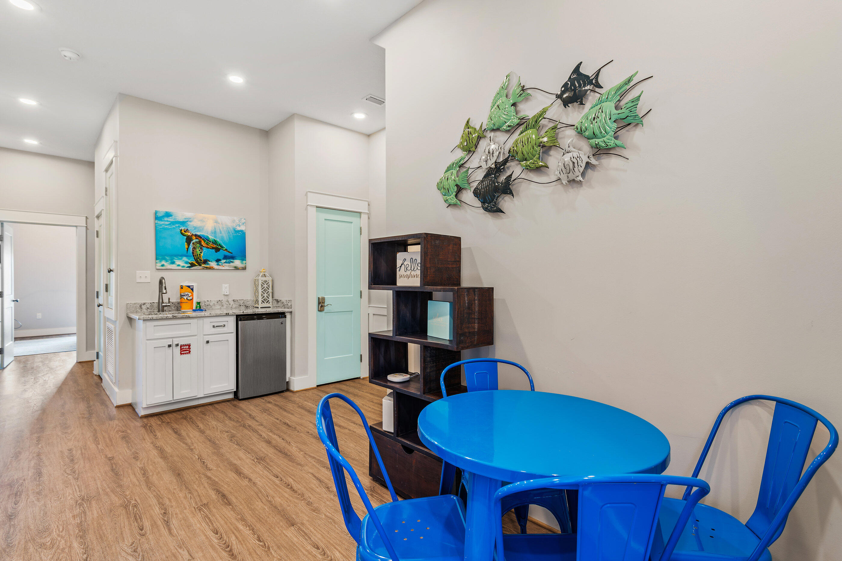 240 Driftwood Road Miramar Beach, FL 32550 - Photo 41 of 65 a kitchen with stainless steel appliances granite countertop a sink dishwasher and a dining table with wooden floor