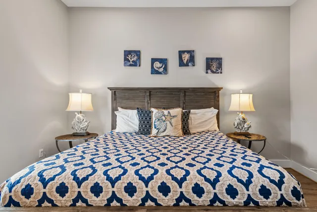 a bedroom with furniture and a wooden floor