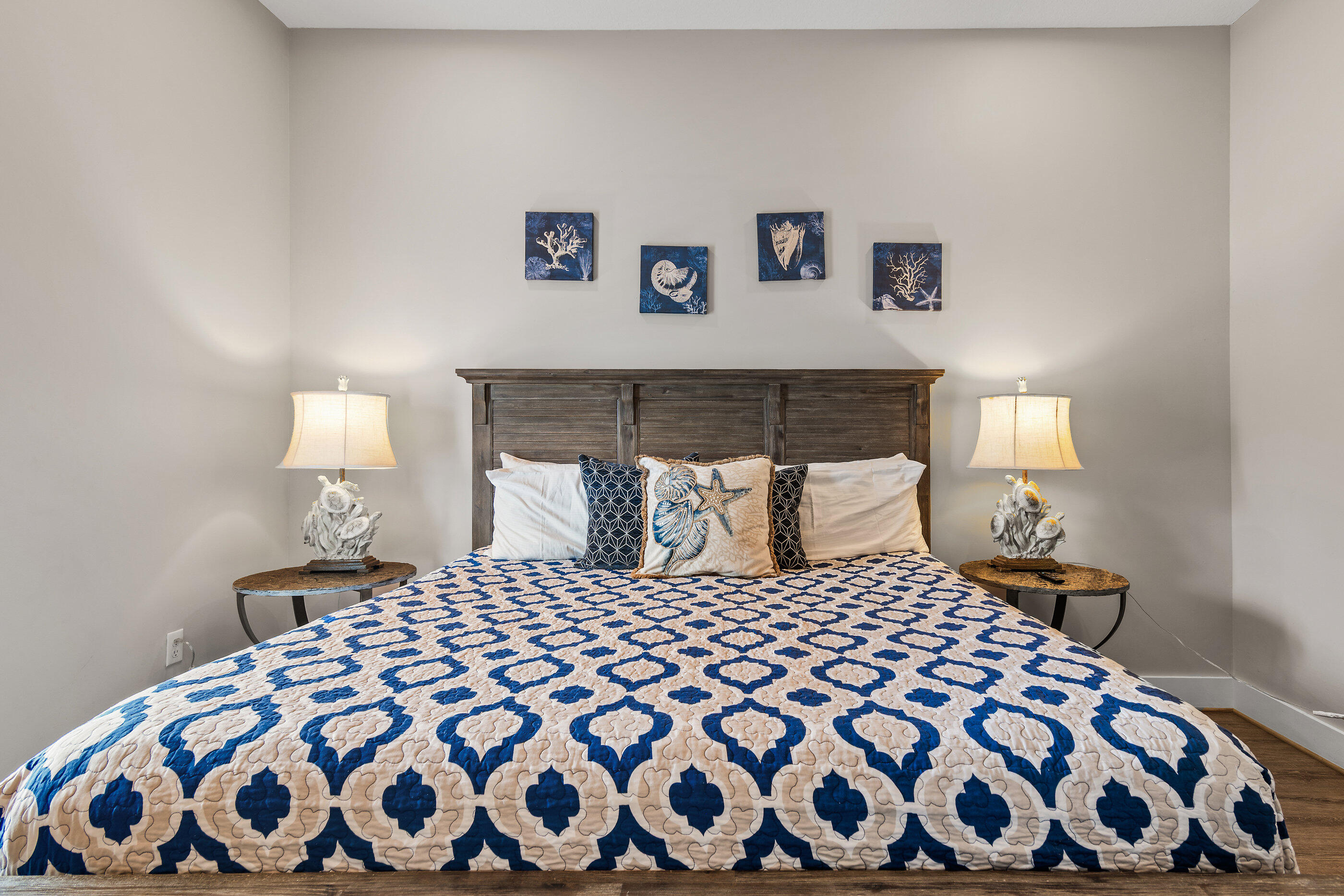 240 Driftwood Road Miramar Beach, FL 32550 - Photo 42 of 65 a bedroom with a large bed and a lamp