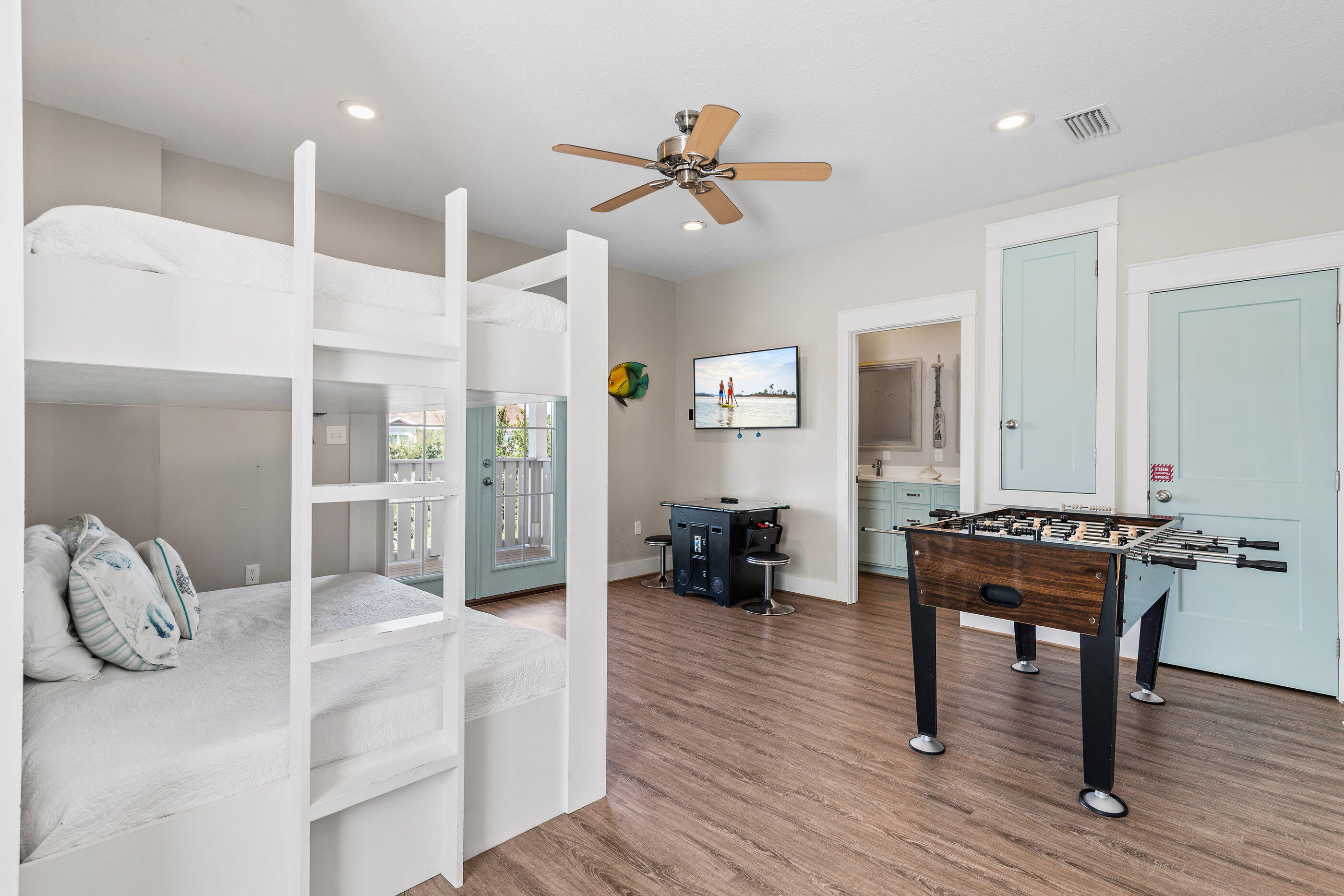 240 Driftwood Road Miramar Beach, FL 32550 - Photo 55 of 65 a bedroom with furniture and a wooden floor