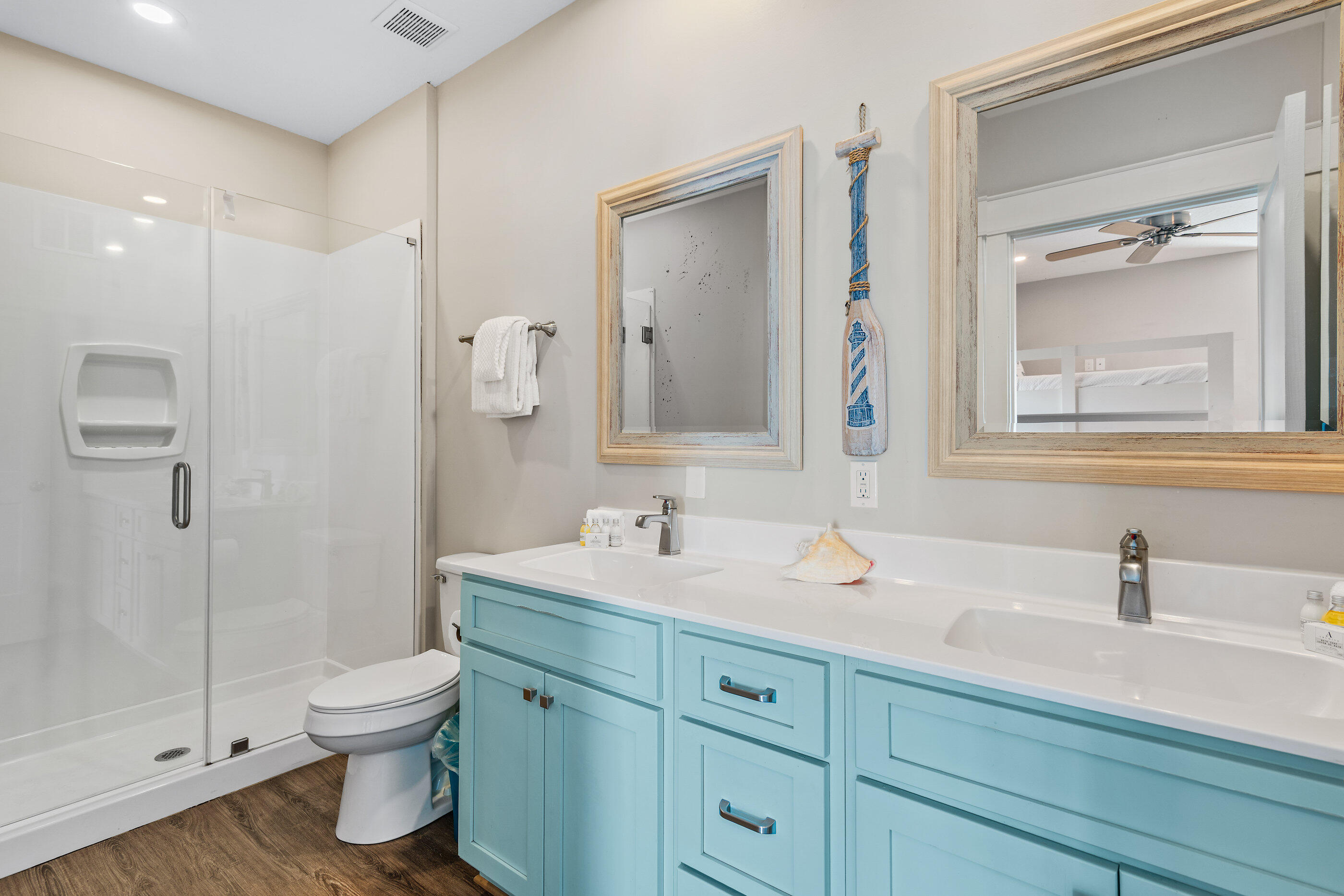 240 Driftwood Road Miramar Beach, FL 32550 - Photo 58 of 65 a bathroom with a toilet a sink a mirror and shower