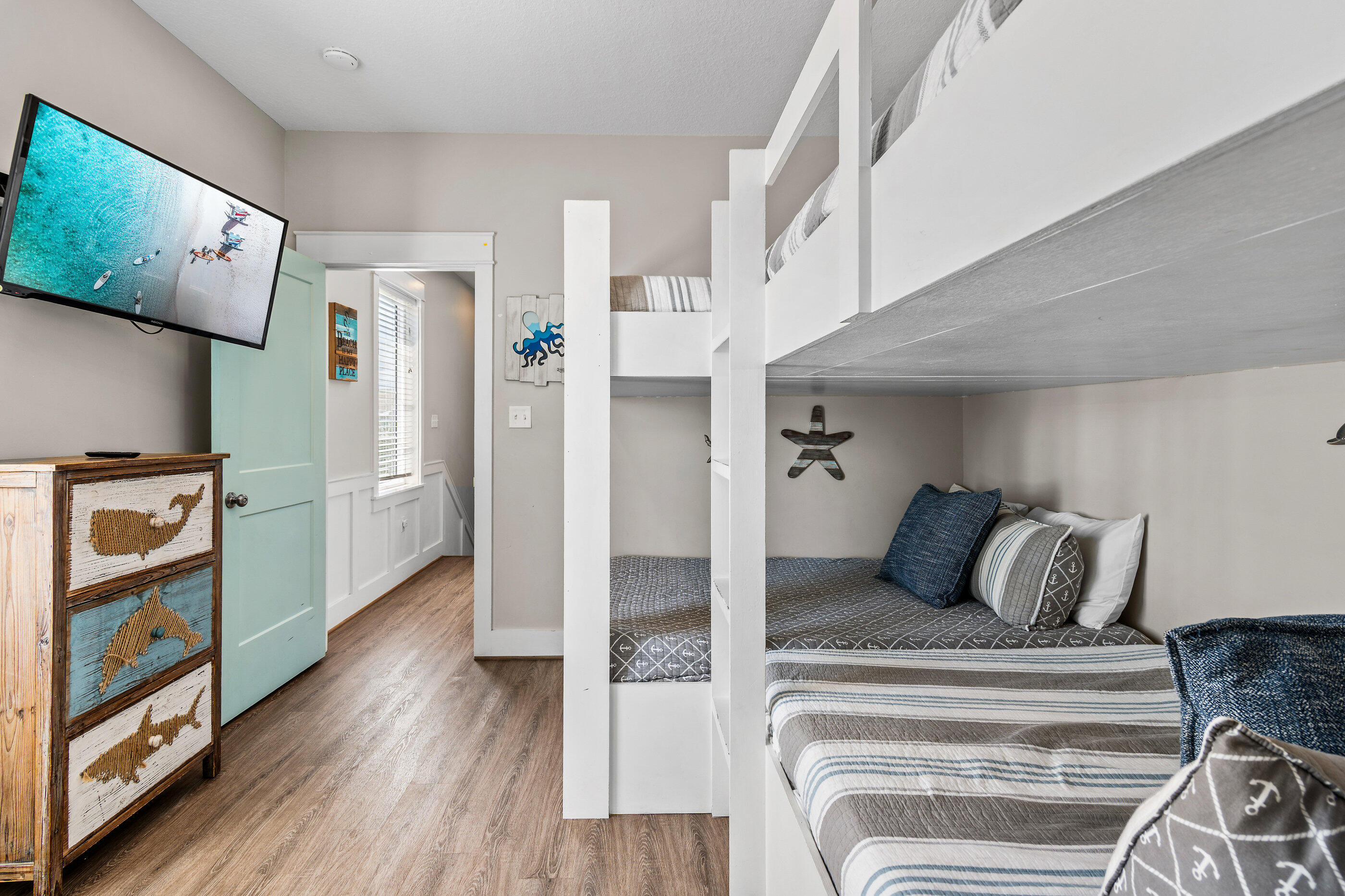 240 Driftwood Road Miramar Beach, FL 32550 - Photo 60 of 65 a bedroom with furniture and a book shelf